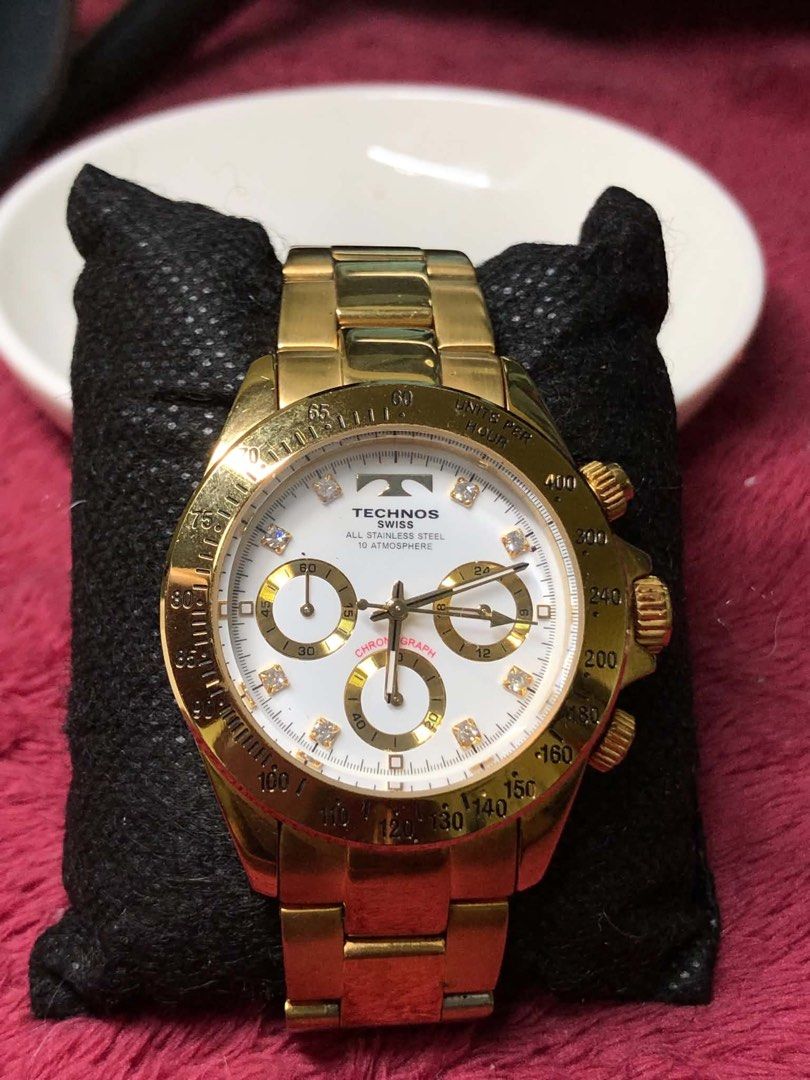 Technos Swiss 10 Atmosphere Chronograph watch (Category: Men's Watches) located in Rodriguez. Submitted by gentlecloud.6f4dfa (Listing ID 1458222302, Image 1). Description: - Gold Technos Swiss Chronograph Watch - All Stainless Steel Construction - Water Resistant up to 10 ATM - White Dial with Diamond Hour Markers - Three Subdials - Tachymeter Bezel - Ideal for Everyday or Special Occasions.