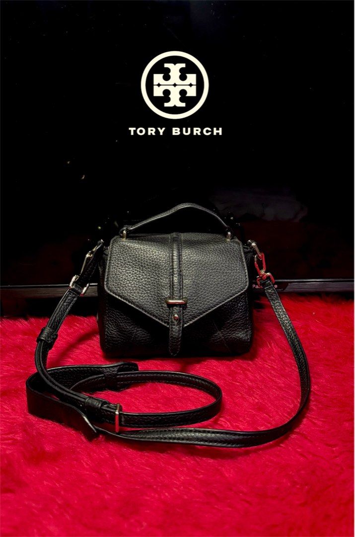 Tory Burch Black Leather Mini 797 Top Handle Bag (Category: Luxury Bags & Wallets) located in Cebu City. Submitted by gabgaaab (Listing ID 1458272437, Image 3). Description: - Tory Burch Black Leather Mini 797 Top Handle Bag - Excellent Condition - Color: Blackt - Material: Textured Leather - Style: Mini Bag - Features: Top handle, detachable crossbody strap - Hardware: Gold - Size: Compact, ideal for essentials - Versatility: Suitable for day or