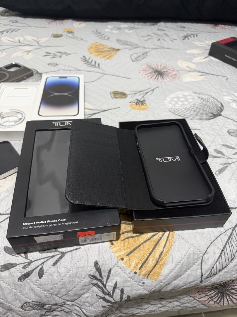 TUMI Magnet Leather Case for iPhone 14 Pro Max (Category: Cases & Sleeves) located in Makati City. Submitted by kiyashidi (Listing ID 1458250918, Image 3). Description: Selling original TUMI Magnet Leather Case for iPhone 14 Pro Max. * 💰 Price: ₱4,500 (slightly negotiable) * 🇺🇸 Bought from TUMI store in the US * 💵 Original SRP: $125 (₱7,700) * ✨ Used only twice, stored since * 📦 Complete inclusions * ✅ 100% Original & Authentic * 💯 Money ba