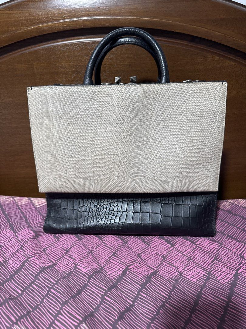 Rouge & Lounge Structured Bag (Category: Luxury Bags & Wallets) located in Pasay City. Submitted by docnanz67 (Listing ID 1458238039, Image 1). Description: - Structured handbag with unique textured details. - Light beige textured front panel. - Black crocodile-embossed base. - Black leather top handles and trim. - Side panel with a distinctive metallic textured finish. - Secure zipper closure at the top. - Spacious interior, ideal for everyday e