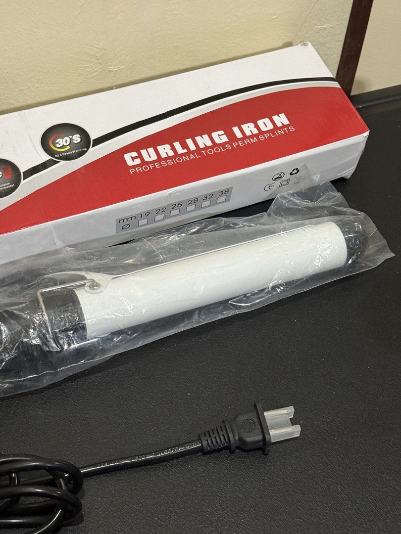 Ubeator Curling Iron Professional Tools Perm Splints (Category: Hair) located in Manila. Submitted by gooddealsmanila (Listing ID 1458280467, Image 3). Description: - Professional curling iron perfect for creating perm styles. - Rapid heating: Reaches 180°C in just 30 seconds. - Multiple barrel sizes available: 19mm, 22mm, 25mm, 28mm, 32mm, and 38mm to suit your styling needs. - Comes complete with a power cord for immediate use. - Ideal for achi