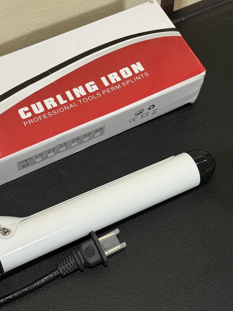Ubeator Curling Iron Professional Tools Perm Splints (Category: Hair) located in Manila. Submitted by gooddealsmanila (Listing ID 1458280467, Image 2). Description: - Professional curling iron perfect for creating perm styles. - Rapid heating: Reaches 180°C in just 30 seconds. - Multiple barrel sizes available: 19mm, 22mm, 25mm, 28mm, 32mm, and 38mm to suit your styling needs. - Comes complete with a power cord for immediate use. - Ideal for achi