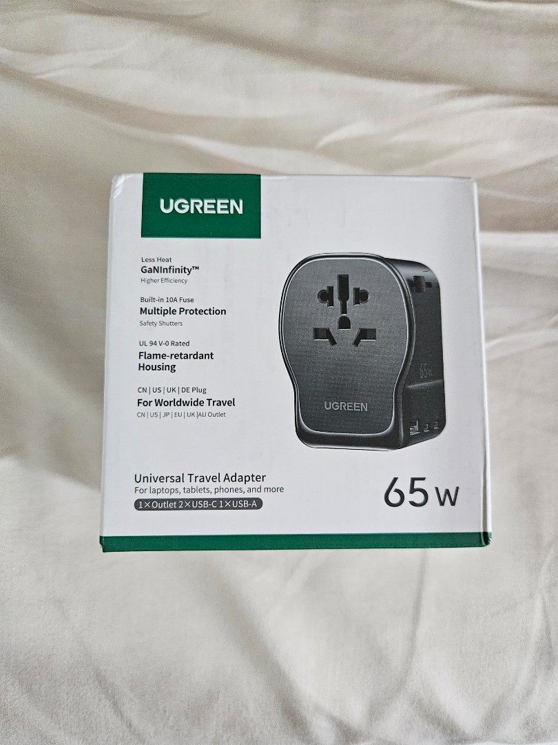 UGREEN 65W Universal Travel Adapter with USB-C (Category: Cables & Adaptors) located in San Juan City. Submitted by desdeclutters (Listing ID 1458111571, Image 1). Description: RFS: bought 2, I only need 1 - UGREEN 65W Universal Travel Adapter - Supports EU, US, UK, AU, CN plugs - 1 AC Outlet + 1 USB-C + 1 USB-A port - Ideal for laptops, tablets, and phones - Built-in 10A fuse for safety - Flame-retardant housing - GaNInfinity technology for effi