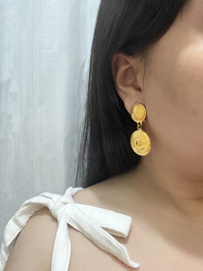 Vintage Chanel Clip-On Earrings (Category: Earrings) located in Paranaque City. Submitted by hellowooorld (Listing ID 1458258832, Image 3). Description: - Authentic Chanel clip-on earrings - Gold tone with iconic CC logo - Circular design with sunburst detailing - Made in France - Perfect statement piece for luxury and vintage Chanel lovers.