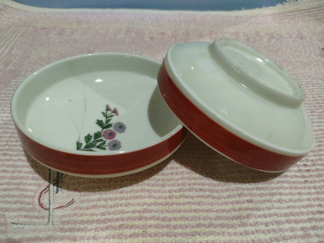 Vintage Floral Ceramic Bowl Set (Category: Other Kitchenware & Tableware) located in Bulacan. Submitted by hunterherojapanjdm (Listing ID 1458161173, Image 2). Description: - Set of two small ceramic bowls - Features delicate pink and purple floral design - Red trim around the rim - Ideal for snacks or small dishes - Approximately 10cm in diameter.