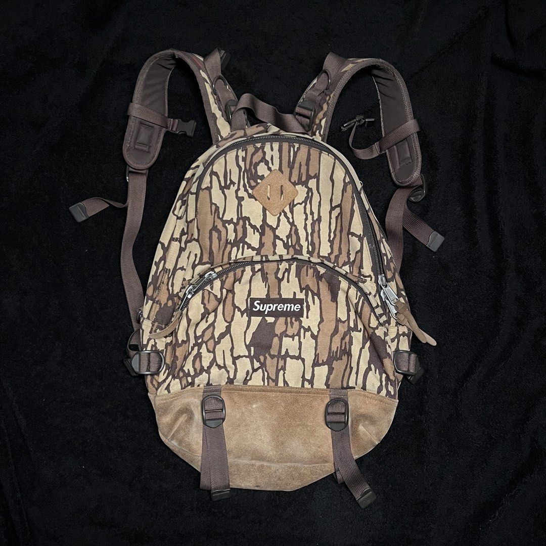 Vintage Supreme F/W 06 Treebark Camo Backpack (Category: Backpacks) located in Marikina City. Submitted by wayupcollective (Listing ID 1458236248, Image 1). Description: Vintage Supreme F/W 06 Treebark Camo Backpack This is a vintage piece Still in good condition 4 compartments Big YKK zippers No major flaws Only flaw: expired garter inside (laptop compartment) Measurement Length: 16” Width: 13” Depth: 5” .