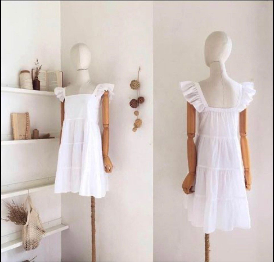 White Tiered Square Neck Mini Dress with Flutter Sleeves (Category: Dresses) located in Quezon City. Submitted by decluttering_alot (Listing ID 1458117349, Image 2). Description: - Actual when worn posted - Cute white mini dress - Square neckline with flutter sleeves - Tiered skirt design - Ideal for casual outings or beach days - Versatile styling with sandals or sneakers Brand: Shop nita RFS Closet Cleanup.