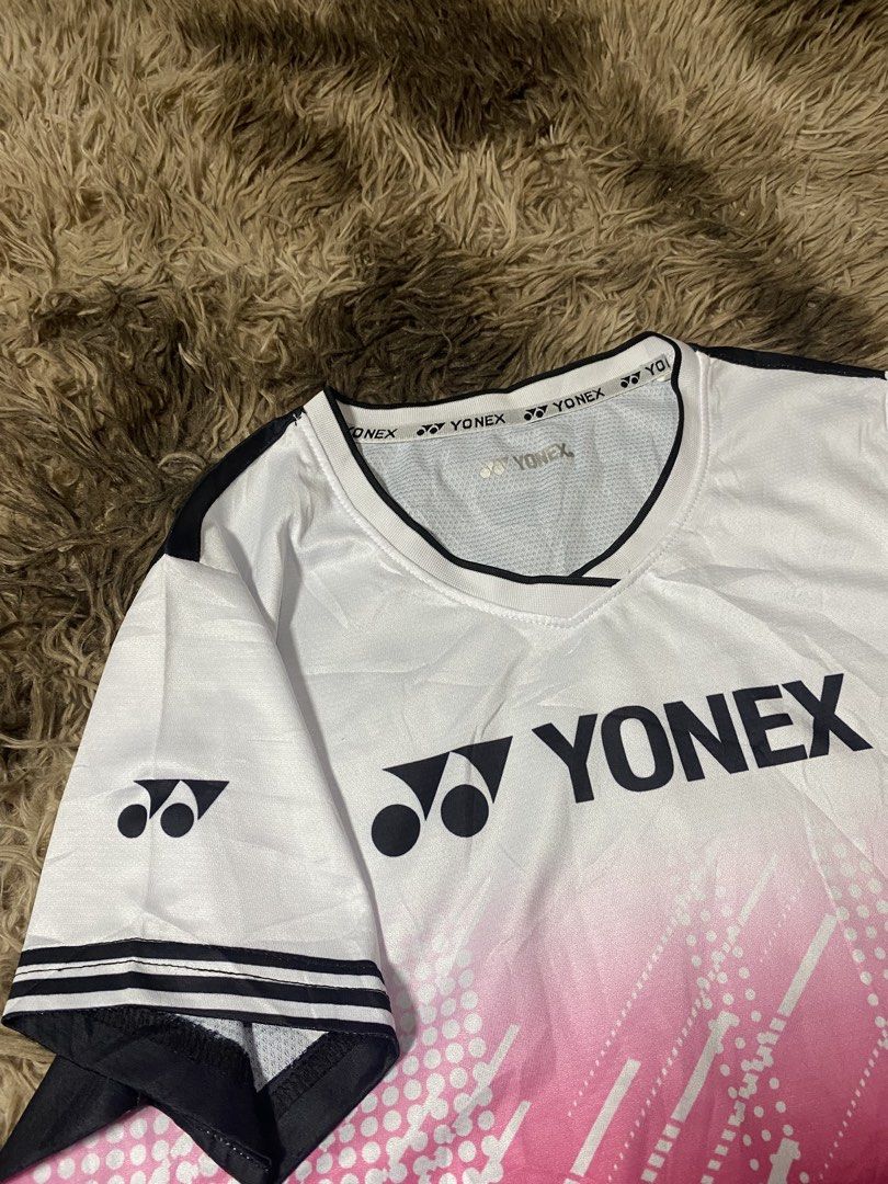 Yonex Badminton Jersey White Pink Blue Gradient (Category: Activewear) located in General Santos City (Dadiangas). Submitted by killcloa2368358 (Listing ID 1458127040, Image 2). Description: - Cool Yonex badminton jersey - White with a stylish pink and blue gradient design - Comfortable material, perfect for playing sports - Clearly displays the iconic Yonex logo - Sleeve cuffs feature black and white stripes.