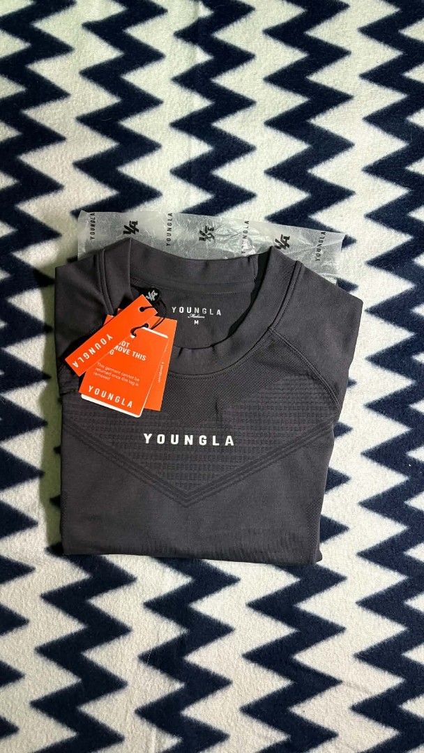 YOUNGLA 475 Supervillain Compression Tee - Charcoal - Size M (Category: Activewear) located in Pasig City. Submitted by bagaholic84 (Listing ID 1458216155, Image 2). Description: - YounGla 475 Supervillain Compression Tee - Color: Charcoal - Size: Medium - Performance shirt, ideal for workouts - Brand new, still in original packaging with tags attached - Never been worn - Excellent deal!.