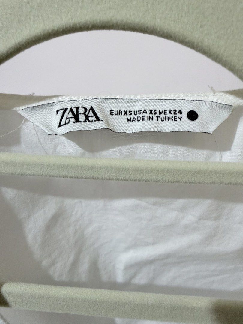 Zara Wraparound Puff Sleeve Top (Category: Blouses) located in Tayug. Submitted by deklutter_ (Listing ID 1458233301, Image 2). Description: Poplin cotton fabric So nice irl! Crisp white XS on tag Upto 36 in bust 22 un length ‼️Pls haggle responsibly. All items are priced according to their overall condition..