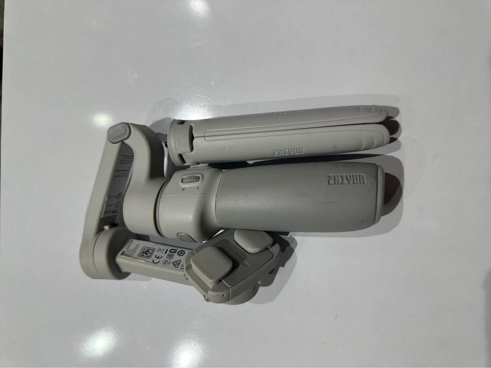 Zhiyun Smooth Q4 Gimbal (Category: Gimbals & Stabilizers ) located in Pasay City. Submitted by mcalfoforo (Listing ID 1458185970, Image 2). Description: - Brand: Zhiyun Like New condition, only used a few times. No issues, smooth and fully working. - Model: Smooth Q4 - Color: White - Condition: Good, pre-loved - Features: Foldable design for portability - Ideal for: Stabilizing smartphone videos.