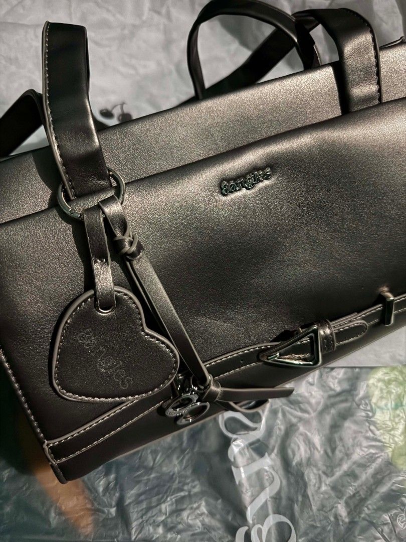 8angles Bae Bag Shoulder Bag Crossbody Bag (Category: Shoulder Bags) located in Pasay City. Submitted by liveturtle0424 (Listing ID 1458406130, Image 2). Description: - no issue - color carbon - Size Medium 32 by 20 cm - comes with a detachable strap for crossbody - zippered main compartment - slip on pocket and zipper compartment inside - button compartment front and back - can negotiate .