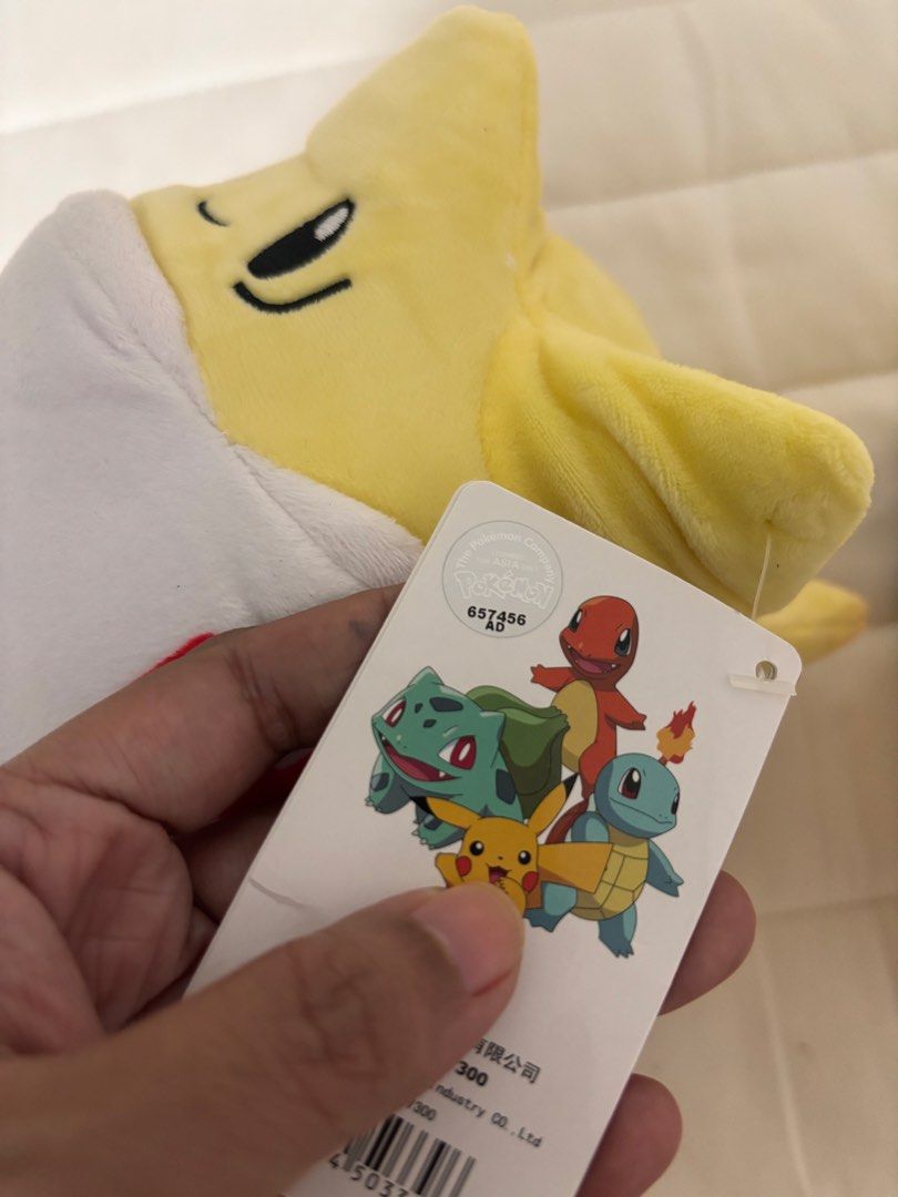 🌟 Pokémon Togepi Plush – Original Tag (Category: Plushies & Soft Toys) located in Manila. Submitted by hellothere2012 (Listing ID 1458443692, Image 3). Description: Price each Cute and cuddly Pokémon Togepi plush 💛🤍 • Pokémon character: Togepi • Yellow & white plush design with signature red/blue patterns • Comes with original Pokémon tags • Approx. 10–11 inches tall • Soft and huggable — great for collectors, kids, or Pokémon fans • Pre-owned