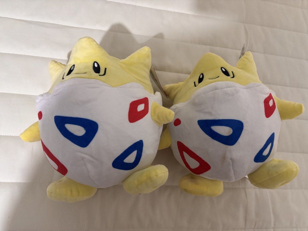 🌟 Pokémon Togepi Plush – Original Tag (Category: Plushies & Soft Toys) located in Manila. Submitted by hellothere2012 (Listing ID 1458443692, Image 2). Description: Price each Cute and cuddly Pokémon Togepi plush 💛🤍 • Pokémon character: Togepi • Yellow & white plush design with signature red/blue patterns • Comes with original Pokémon tags • Approx. 10–11 inches tall • Soft and huggable — great for collectors, kids, or Pokémon fans • Pre-owned