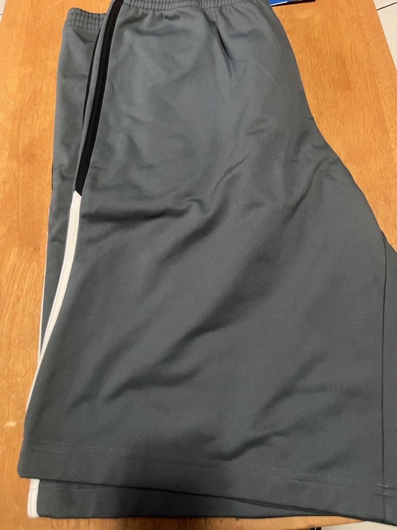 Adidas (Category: Shorts) located in Quezon City. Submitted by shopaholics.31 (Listing ID 1458311939, Image 3). Description: These are adidas Men’s Linear Graphic Athletic Shorts in the “Onix” grey colorway, featuring a unique hybrid brand mark that blends the classic Trefoil logo with vertical retro block lettering down the left thigh.Product Design DetailsColorway: Onix Grey base body with contrasting solid black and white 3-Stripes running dow