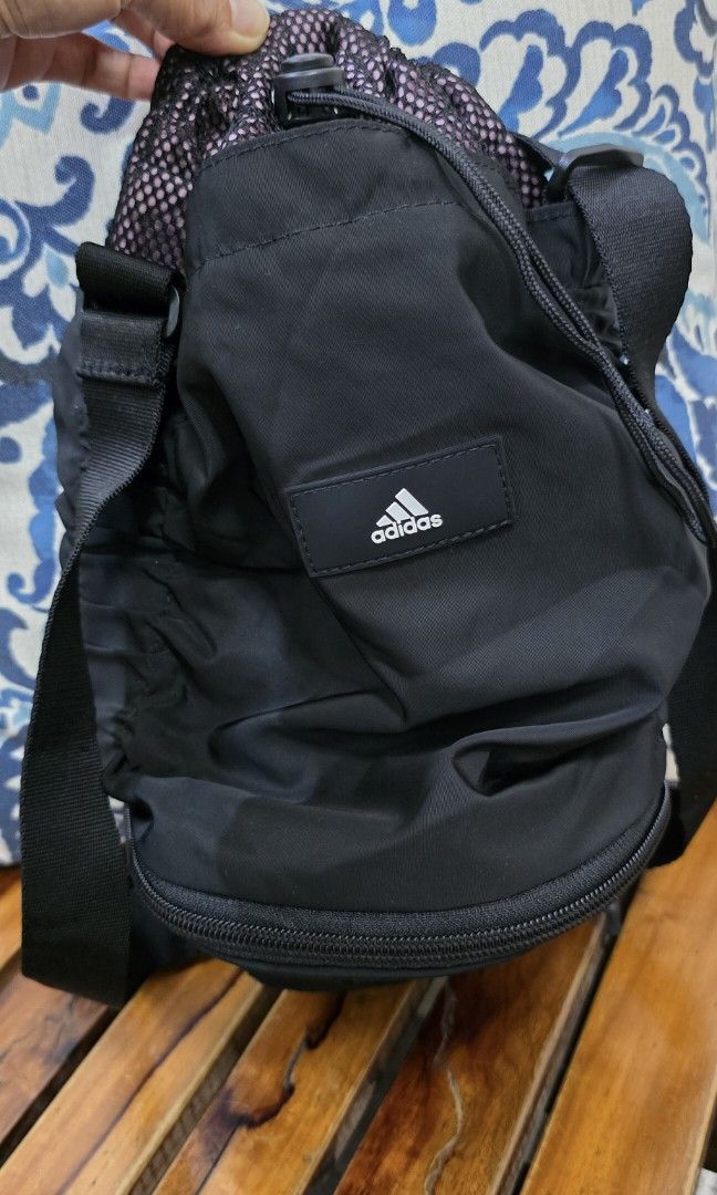 Adidas yoga convertible drawstring bag (Category: Shoulder Bags) located in Manila. Submitted by loved_collections (Listing ID 1458438454, Image 3). Description: like new! no fades super black pa in actual adjustable sling strap- can be worn crossbody or shoulder bag. semi-medium size- fit-in water bottle SALE!.