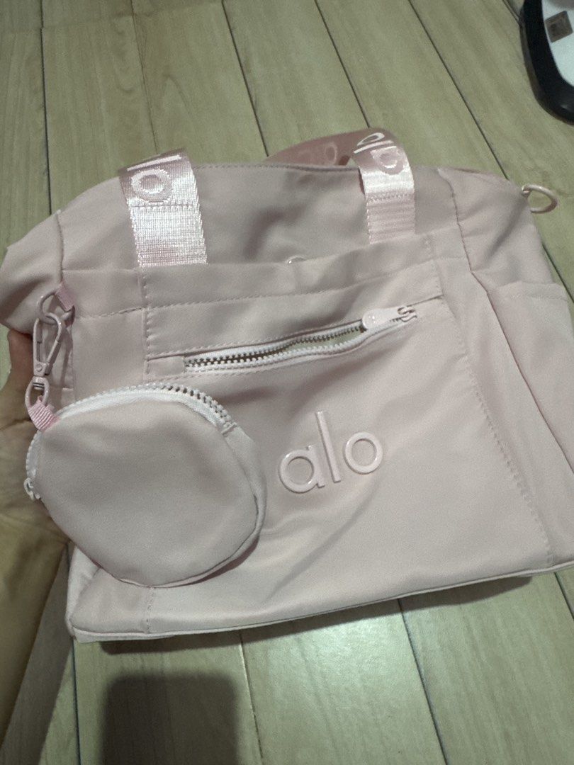 alo pink bag with pouch (Category: Luxury Bags & Wallets) located in Malabon City. Submitted by nanayinah (Listing ID 1458316020, Image 1). Description: - can fit 14 inch laptop - front zip and no-zip pocket - includes a small matching zip pouch (attached) - with extra straps - only used once in the office! - negotiable for sure buyers.