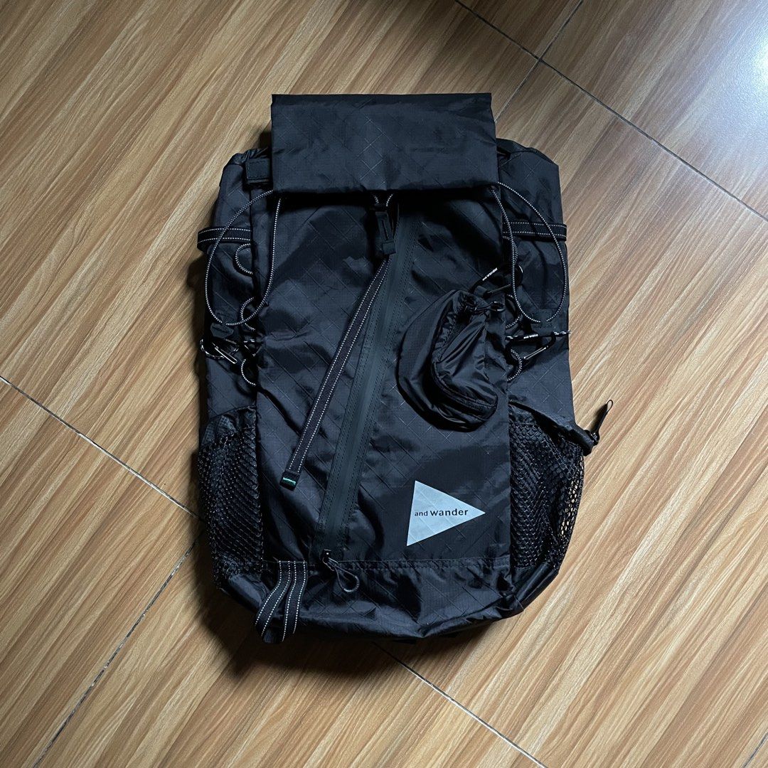 And Wander ECOPAK 30L Backpack - Black (Category: Backpacks) located in General Mariano Alvarez. Submitted by 4117_thriftnthrive (Listing ID 1458465756, Image 1). Description: Brand new condition No flaws The and wander ECOPAK 30L Backpack is shown here in black, constructed from water-resistant, recycled polyester with a distinct diamond grid pattern..