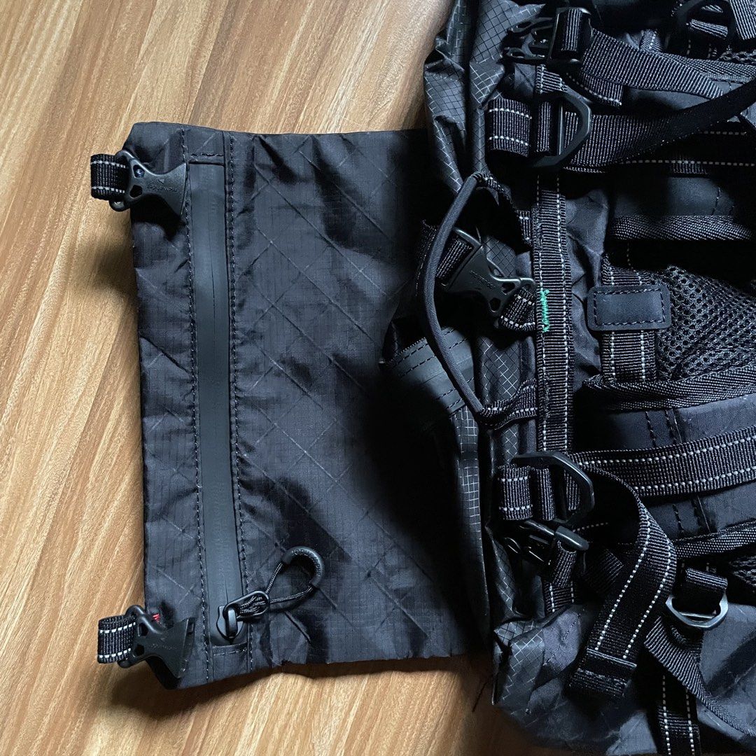And Wander ECOPAK 30L Backpack - Black (Category: Backpacks) located in General Mariano Alvarez. Submitted by 4117_thriftnthrive (Listing ID 1458465756, Image 3). Description: Brand new condition No flaws The and wander ECOPAK 30L Backpack is shown here in black, constructed from water-resistant, recycled polyester with a distinct diamond grid pattern..