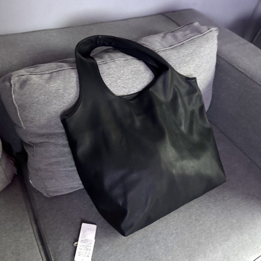 APC Black Ninon Tote Bag Large (Category: Luxury Bags & Wallets) located in Quezon City. Submitted by marketbuenaobra (Listing ID 1458399367, Image 3). Description: - Guaranteed Authentic. Store bought. - Well loved with some visible signs of wear. (Pls see pics) - Selling low. Srp: ₱16k+ - RFS: Decluttering.