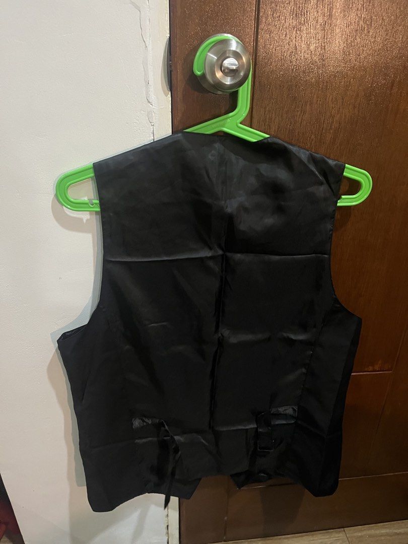 Arrow Black Formal Vest XL (Category: Vests) located in Pasig City. Submitted by kakerts (Listing ID 1458449686, Image 2). Description: - Brand: Arrow - Color: Black - Size: XL - Style: Formal Vest - Features: Button-up front, has pockets - Occasion: Formal events, part of a suit.