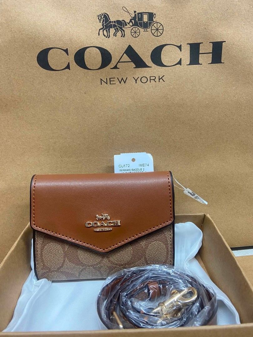 Authentic Coach Wallet with strap (Category: Wallets & Card holders) located in Santa Cruz. Submitted by janelovebagswatchesshoesph (Listing ID 1458430841, Image 3). Description: 100% Authentic with complete inclusions actual photos posted.