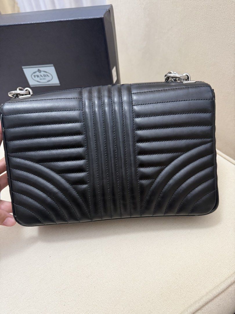 Authentic Prada Diagramme Chain Flap Shoulder Bag (Category: Luxury Bags & Wallets) located in Manila. Submitted by maria_2326 (Listing ID 1458394589, Image 2). Description: Prada Diagramme Chain Flap Guarantee Authentic Inclusions: Box and dust bag only No to lowballing! Location: Manila/QC.