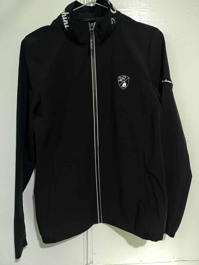 Automobili Caninos Lamborghini Track Jacket (Category: Coats, Jackets and Outerwear) located in Baguio. Submitted by azcollections_scar (Listing ID 1458354235, Image 1). Description: - Black track jacket with Lamborghini branding - Full zip front - Small embroidered logo on chest - Two side pockets - Ideal for casual wear or sports W-17.5 x L-25 Accepting good offer.