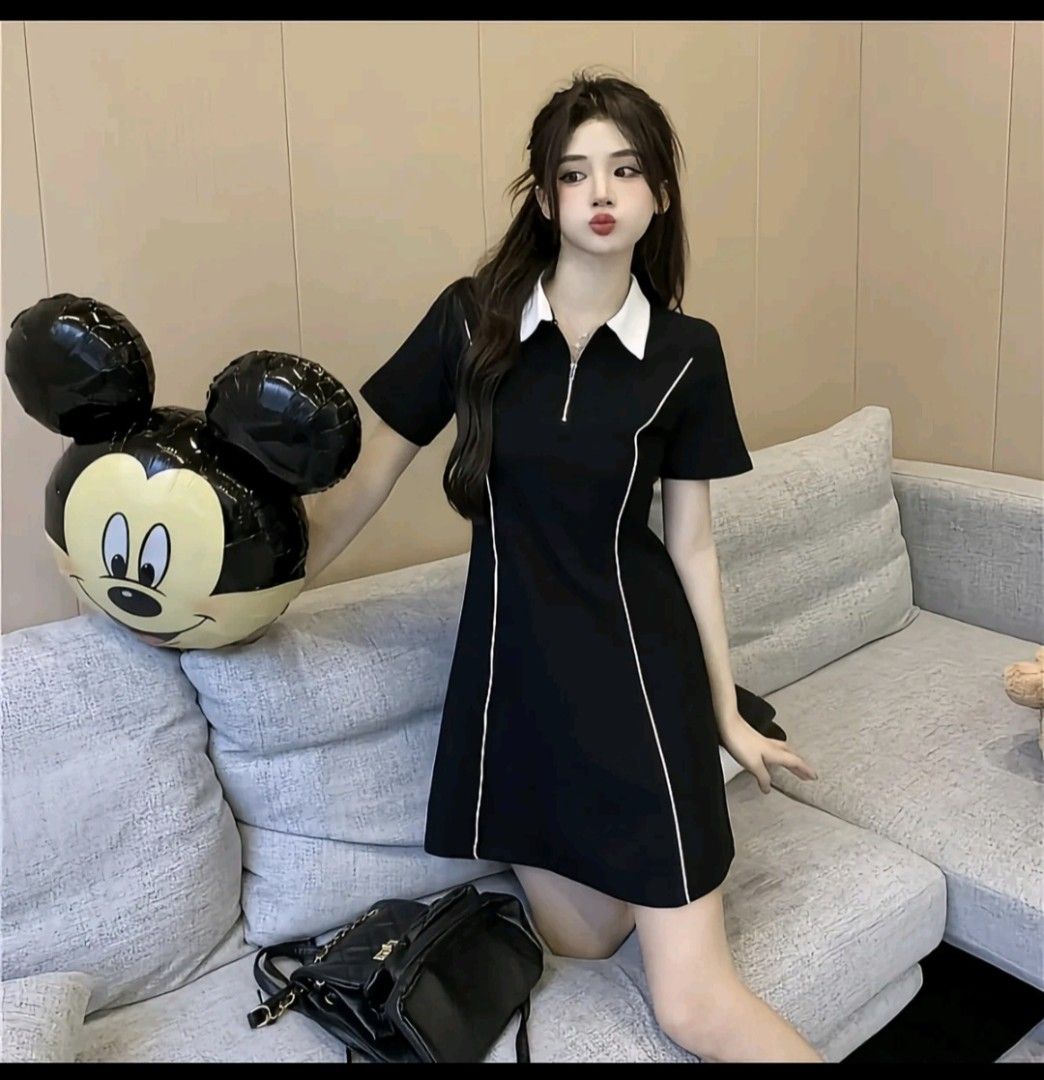 Black Collared Zip-Up Mini Dress with White Piping (Category: Dresses) located in Manila. Submitted by famiefany (Listing ID 1458306767, Image 1). Description: - Cute black mini dress - Features a white collar and zip-up front Size: 2-3xl - White piping details along the sides - Short sleeves - Perfect for casual outings or a night out - Easy to wear and style.