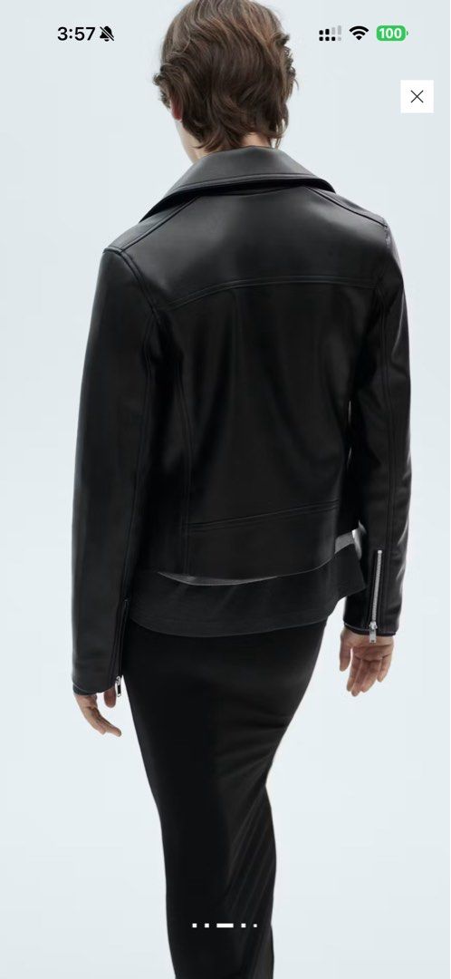 Black Faux Leather Biker Jacket (Category: Coats, Jackets and Outerwear) located in Quezon City. Submitted by ianngailuy (Listing ID 1458483746, Image 3). Description: - Classic black faux leather biker jacket - Zip-up front closure - Silver hardware details - Versatile outerwear piece - Looks great dressed up or down - Ideal for layering over sweaters or t-shirts.