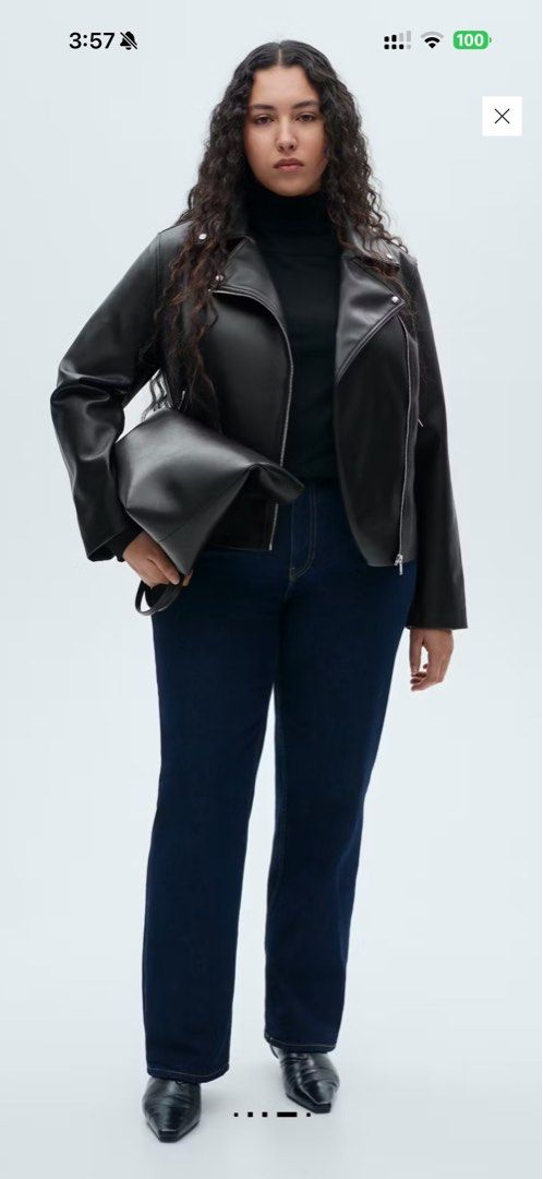 Black Faux Leather Biker Jacket (Category: Coats, Jackets and Outerwear) located in Quezon City. Submitted by ianngailuy (Listing ID 1458483746, Image 2). Description: - Classic black faux leather biker jacket - Zip-up front closure - Silver hardware details - Versatile outerwear piece - Looks great dressed up or down - Ideal for layering over sweaters or t-shirts.