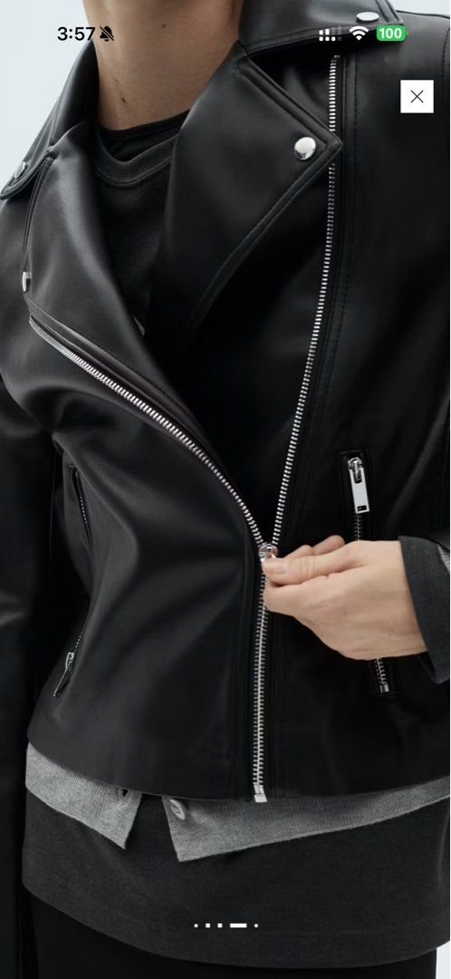 Black Faux Leather Biker Jacket (Category: Coats, Jackets and Outerwear) located in Quezon City. Submitted by ianngailuy (Listing ID 1458483746, Image 1). Description: - Classic black faux leather biker jacket - Zip-up front closure - Silver hardware details - Versatile outerwear piece - Looks great dressed up or down - Ideal for layering over sweaters or t-shirts.