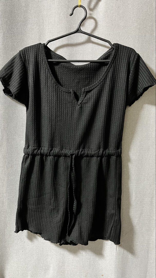 Black Waffle Knit Drawstring Romper (Category: Rompers) located in Manila. Submitted by _littlebunny (Listing ID 1458439265, Image 2). Description: - Comfy black romper - Waffle knit texture - Short sleeves - V-neckline with tie detail at the waist - Lettuce edge hem - Ideal for lounging or casual outings - Easy to wear and style.