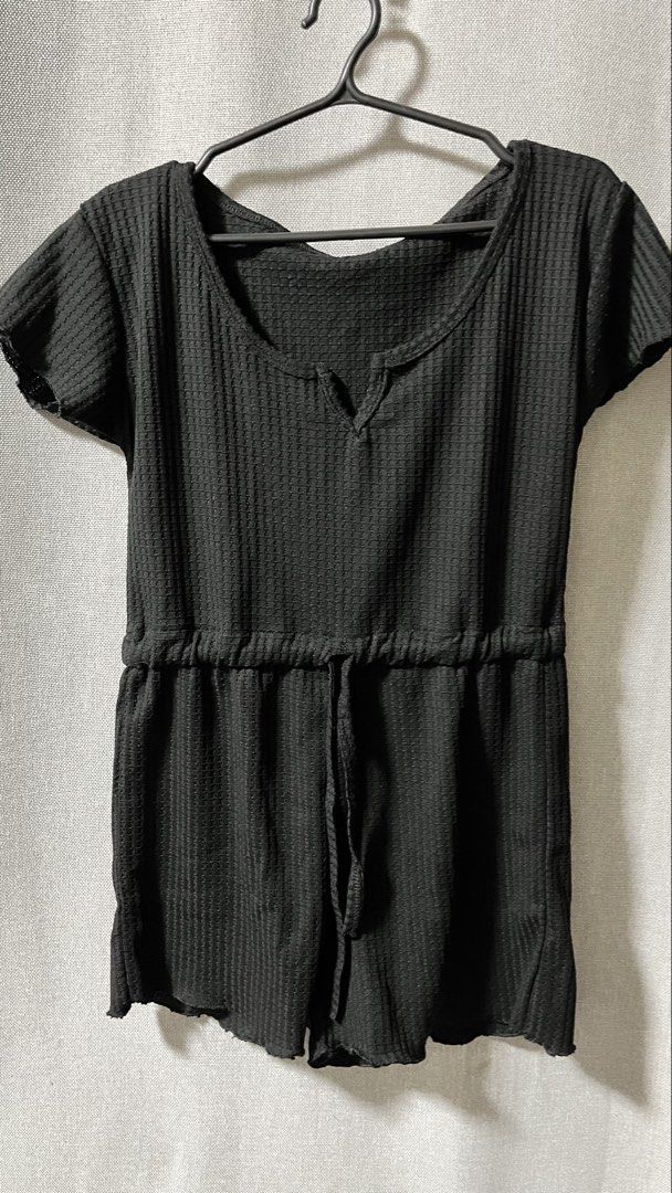 Black Waffle Knit Drawstring Romper (Category: Rompers) located in Manila. Submitted by _littlebunny (Listing ID 1458439265, Image 3). Description: - Comfy black romper - Waffle knit texture - Short sleeves - V-neckline with tie detail at the waist - Lettuce edge hem - Ideal for lounging or casual outings - Easy to wear and style.