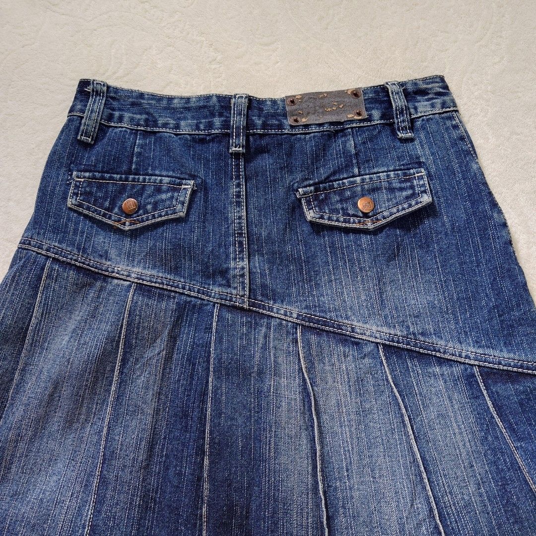 Blue Denim Pleated Mini Skirt (Category: Skirts) located in Diffun. Submitted by declutteredbyJill (Listing ID 1458310075, Image 3). Description: -waist 28 29, length 18 - Cute blue denim mini skirt - All-around pleated design - Functional front and back pockets - Secure button and zip closure - Ideal for casual wear and easy to style.