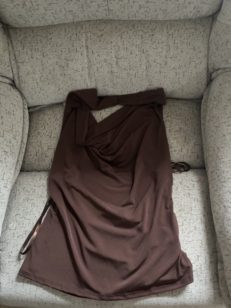 Brown halter top (Category: Sleeveless) located in Manila. Submitted by cokezer0__ (Listing ID 1458386376, Image 1). Description: brown halter top :) dm for when worn!! only worn once abroad. bought this in urban outfitters nyc from a trip last year.