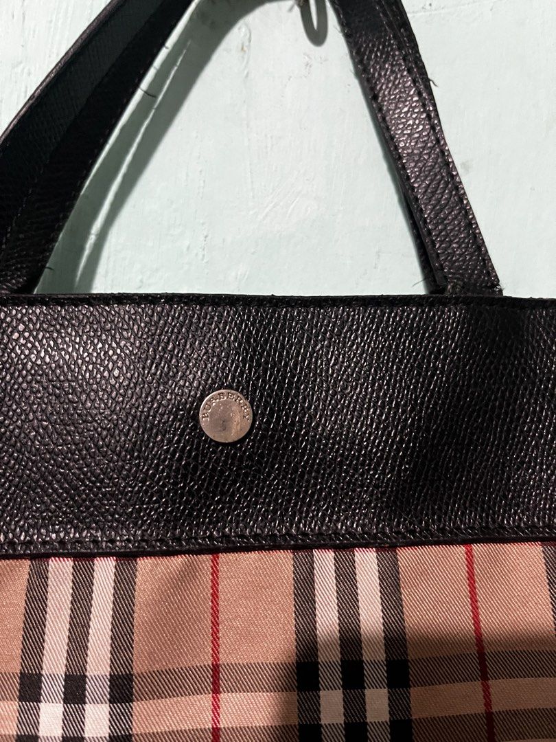 Burberry London Tote Bag (Category: Luxury Bags & Wallets) located in Manila. Submitted by shanaaa.collects (Listing ID 1458318232, Image 1). Description: - Classic Burberry tote bag - Iconic nova check pattern - Black leather trim and handles - Interior zip pocket - Snap closure for secure storage - Ideal for everyday use.