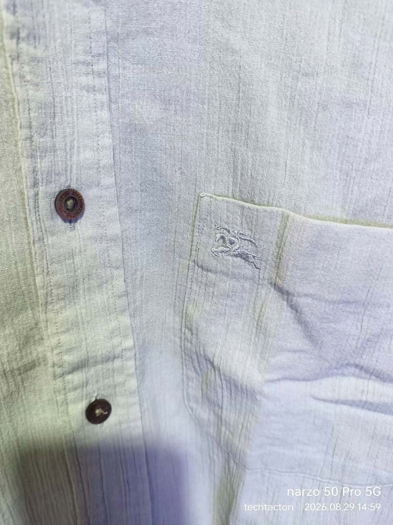 Burberrys Textured button down (Category: Luxury Apparel) located in Santo Tomas. Submitted by pickers_corner (Listing ID 1458439778, Image 2). Description: vintage 90s Burbs Textured button down size MA dime 22.5x27 still in pristine condition no holes no stain - Burberrys short sleeve shirt - Size: M - Color: Light beige - Texture: Subtle stripes - Style: Classic button-up - Perfect for: Casual wear.