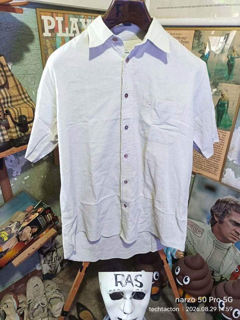 Burberrys Textured button down (Category: Luxury Apparel) located in Santo Tomas. Submitted by pickers_corner (Listing ID 1458439778, Image 1). Description: vintage 90s Burbs Textured button down size MA dime 22.5x27 still in pristine condition no holes no stain - Burberrys short sleeve shirt - Size: M - Color: Light beige - Texture: Subtle stripes - Style: Classic button-up - Perfect for: Casual wear.