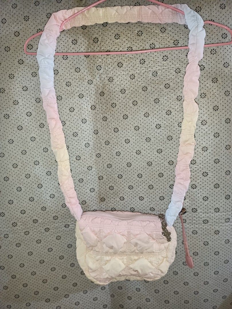 Carlyn Cotton Puff Small Sling Bag (Category: Cross-body Bags) located in Bolinao. Submitted by shayne_0215 (Listing ID 1458441896, Image 1). Description: - Cute pastel gradient adjustable Sling/Crossbody - Brand: Carlyn - Quilted with a soft puff texture - Zipper closure with a cute charm on the pull - Lined interior with a small pocket - Ideal for everyday use - Easy to carry and fits essentials Deal Now, Pay Now MOP: GCASH SF will be shouldere