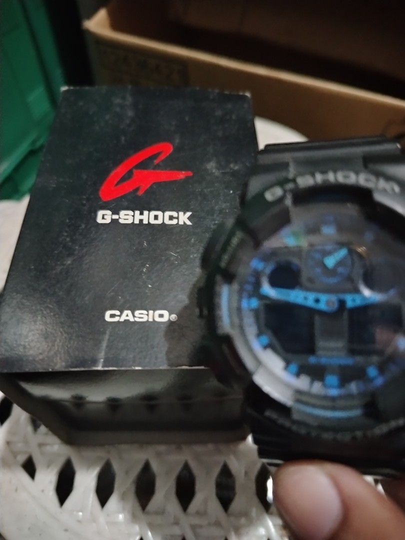 Casio G-Shock GA-100 Watch (Category: Men's Watches) located in Manila. Submitted by choyxxvi (Listing ID 1458361982, Image 3). Description: - Authentic Black Casio G-Shock GA-100 - Striking blue and black digital display - Robust 20 Bar water resistance - Includes original box - Ideal for everyday wear and active lifestyles.