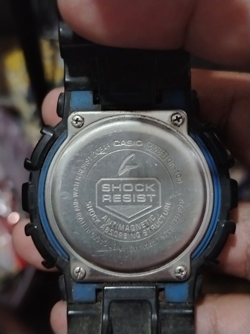 Casio G-Shock GA-100 Watch (Category: Men's Watches) located in Manila. Submitted by choyxxvi (Listing ID 1458361982, Image 2). Description: - Authentic Black Casio G-Shock GA-100 - Striking blue and black digital display - Robust 20 Bar water resistance - Includes original box - Ideal for everyday wear and active lifestyles.