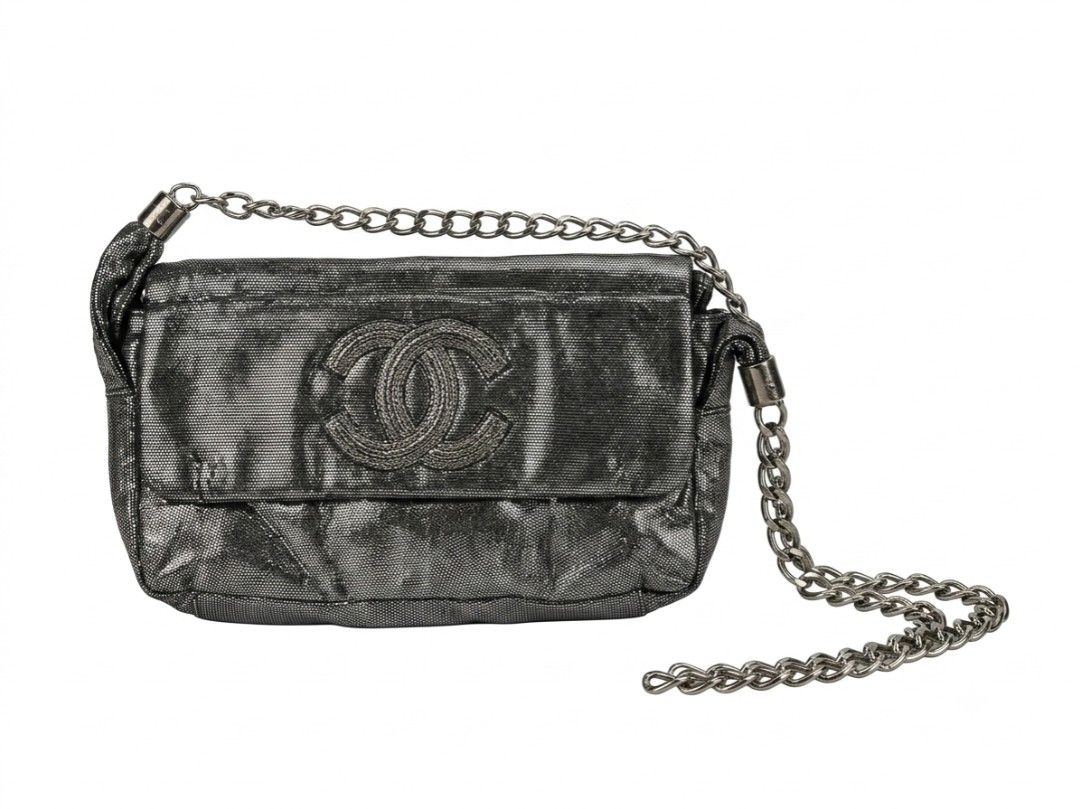 Chanel Black Metallic Clutch Chain Bag (Category: Luxury Bags & Wallets) located in Manila. Submitted by youngturtle.8e129a (Listing ID 1458345438, Image 1). Description: - Sleek black metallic clutch - Iconic embossed CC logo on the front - Detachable chain strap for versatile wear - Interior zippered pocket for essentials - Lined with classic Chanel logo pattern - Authentically Made in France - A sophisticated accessory for any occasion.