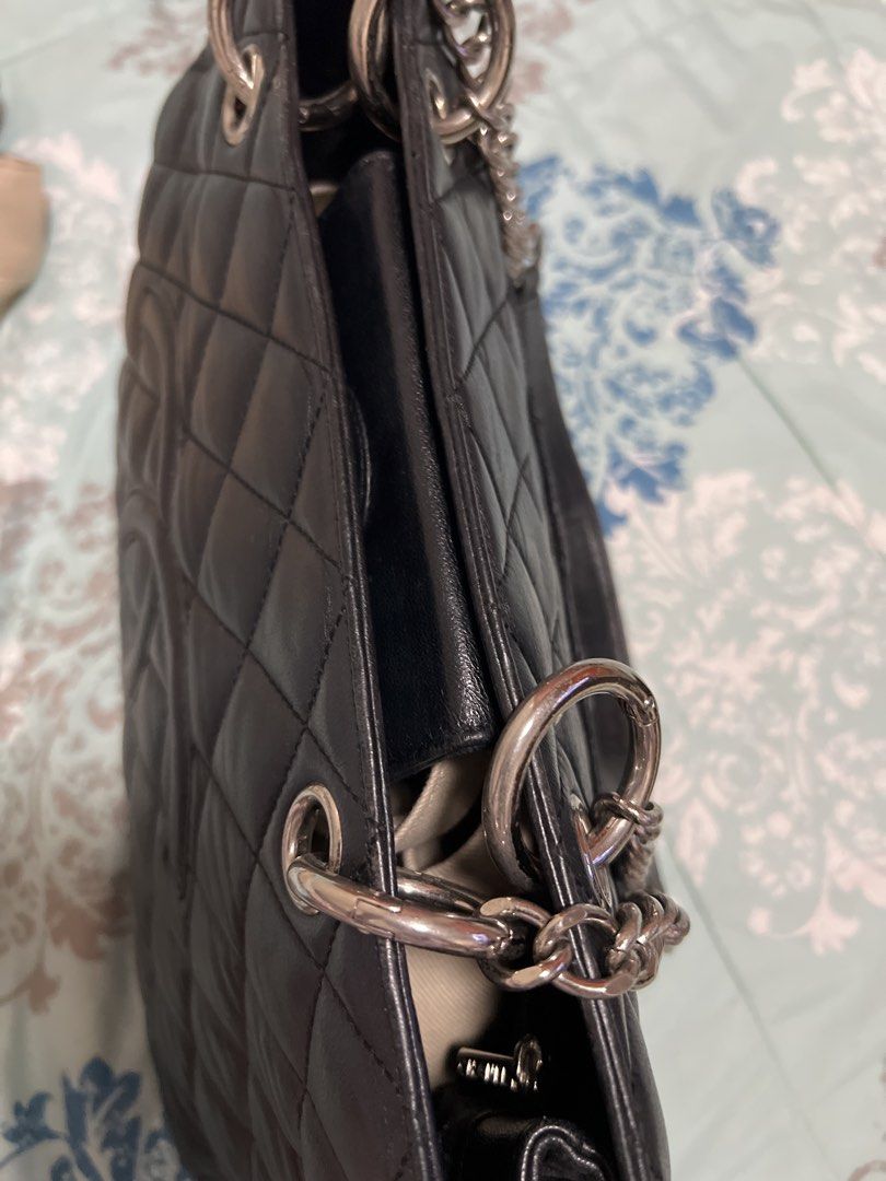 Chanel Black Quilted Leather Tote Bag (Category: Luxury Bags & Wallets) located in San Pedro. Submitted by nemesis.nemesis (Listing ID 1458401095, Image 2). Description: - Classic black quilted leather Chanel tote - Iconic silver CC logo - Front pocket - Zip closure - Interior zip pocket and main compartment - Chain and leather straps - Ideal for everyday use - korea sourced - no code.