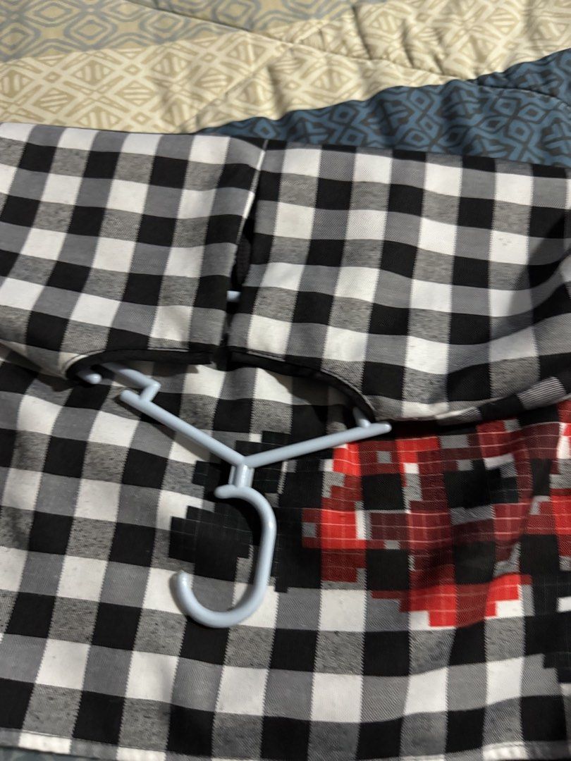 Chekered Black & White Top with Pixelated Roses (Category: Sleeveless) located in Davao. Submitted by z0phia (Listing ID 1458430405, Image 3). Description: - Cute black and white gingham fabric - Features a unique pixelated red rose design on the front - Short sleeves for a comfortable fit - Classic round neckline with a subtle black trim - Convenient zipper closure at the back - Brand: PLANETSPROUTS - Ideal for a stylish casual look.