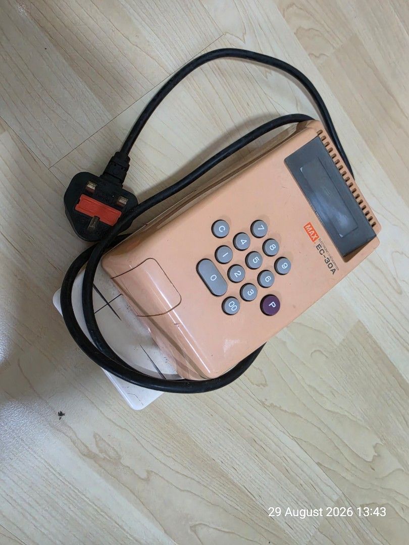 Cheque Printer (Category: Office & Business Technology) located in Singapore. Submitted by sales_sg50 (Listing ID 1458351685, Image 1). Description: - MAX EC-30A Electronic Cheque Printer - Classic peach color - Clear display screen - Easy-to-use numeric keypad - Includes original power cord and plug - Good working condition.