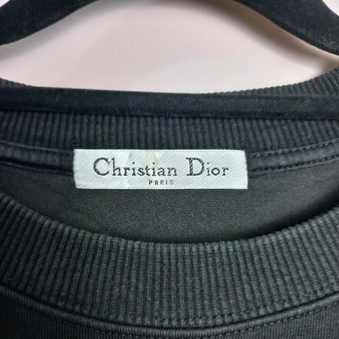 Christian Dior Crewneck Sweatshirt (Category: Others Tops) located in Naga. Submitted by whimsy_vault (Listing ID 1458312631, Image 3). Description: Christian Dior crewneck sweatshirt featuring a teal embroidered "DIOR" logo with a blue floral graphic replacing the letter "I". FLAT LAY MEASUREMENTS (Approximate): • Pit to Pit: 23 inches • Length (Shoulder to Hem): 26 inches.