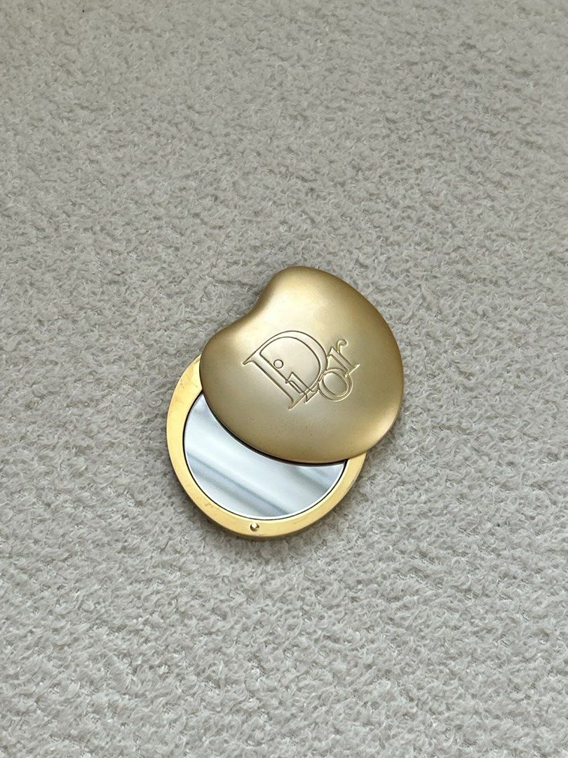 Christian Dior Gold Compact Mirror (Category: Mirrors) located in Quezon City. Submitted by NiniTheExplorer (Listing ID 1458481344, Image 3). Description: - Vintage Christian Dior compact mirror - Gold tone finish - Features iconic Dior logo - Clear mirror inside - Classic Parfums Christian Dior piece - Small and portable for easy carrying.