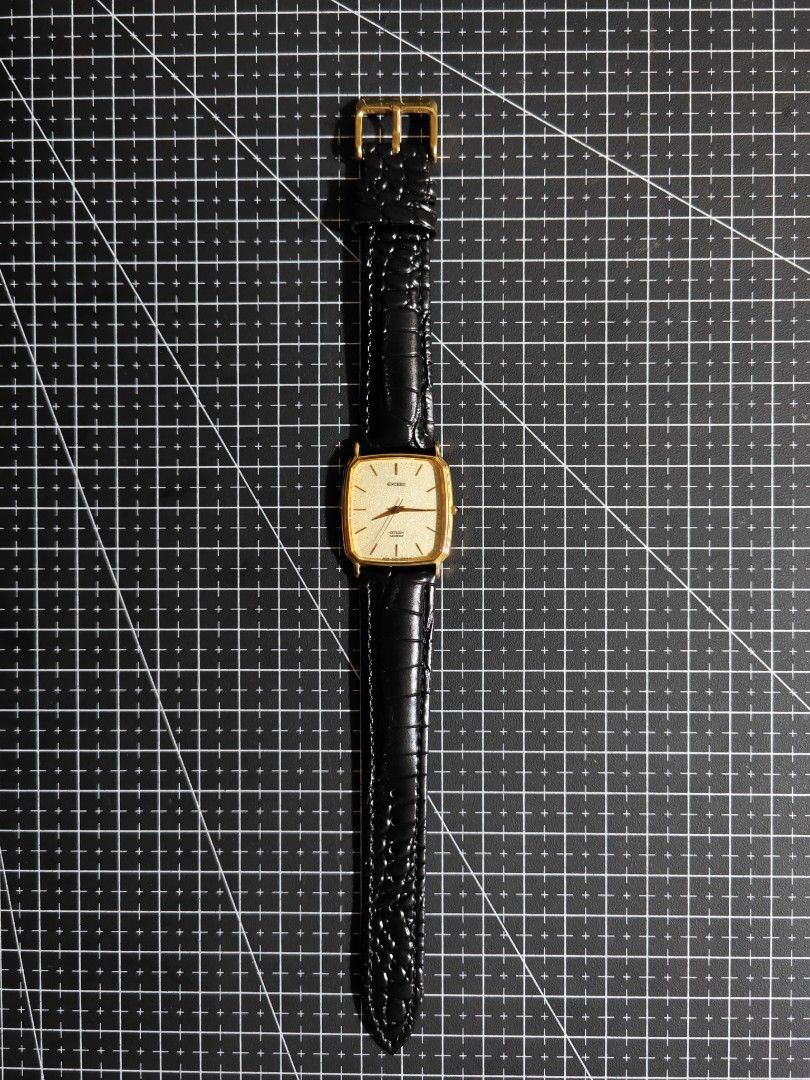 Citizen Exceed Quartz Gold Tone Square Watch (Category: Luxury Watches) located in Makati City. Submitted by reyf86 (Listing ID 1458488260, Image 2). Description: - Classic Citizen Exceed watch - Gold-tone square case - Textured dial - Black leather strap with crocodile texture - Quartz movement - Simple and elegant design - Versatile for everyday or formal wear Dm if interested .
