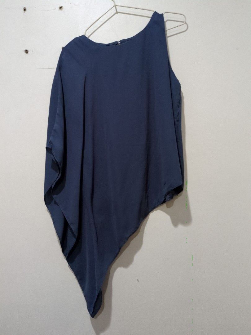 Classy One Sided Top (Category: Blouses) located in Mandaluyong City. Submitted by bbcatham (Listing ID 1458437084, Image 1). Description: Classy one sided top. Pwede pang office. Polyester material. Size: Medium on tag Bust: 36in PS. Missing button at the back (see last slide).